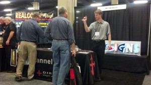 Candid photo of Direct Sign Wholesale booth at expo