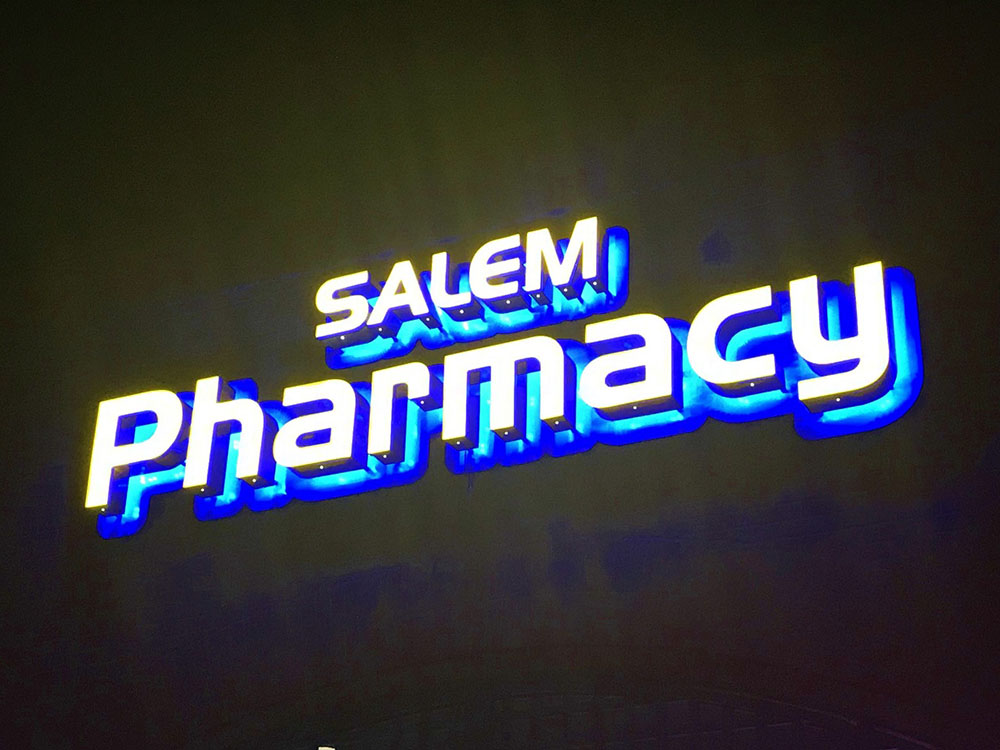 Salem Pharmacy halo lit channel letters at night